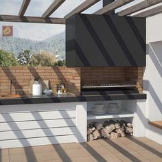 an outdoor kitchen with grill, sink and counter space under a pergolated roof