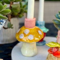 a candle is sitting on top of a mushroom