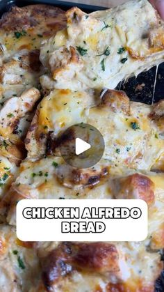 the chicken alfredo bread has been cut into pieces and is being held up with a spatula