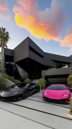 two pink and black lambs parked in front of a large building with palm trees