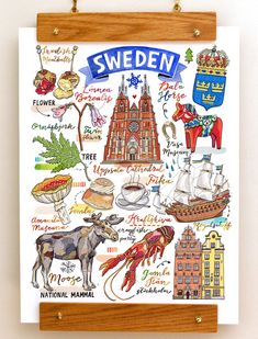 a wooden frame holding a poster with different things on it and the words sweden written in blue