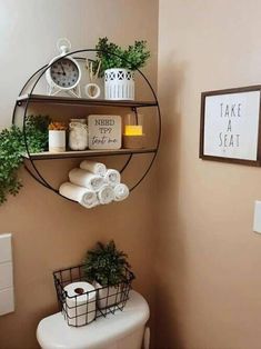 a bathroom with a toilet and shelves above it