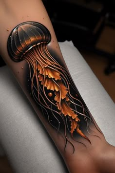 a tattoo with an orange jellyfish on it's arm and legs, sitting on a white chair