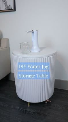 a white sink sitting on top of a wooden floor