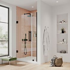 a bathroom with a walk in shower next to a window and a bench near by