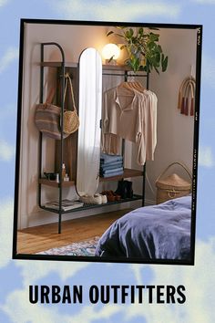 an image of a bedroom setting with clothes hanging on racks and the words urban outfitters above it