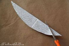 an origami airplane made out of paper and scissors