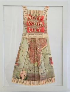 a dress made out of newspaper paper with the words new york city printed on it