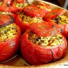 stuffed red peppers with rice and seasoning in a bowl