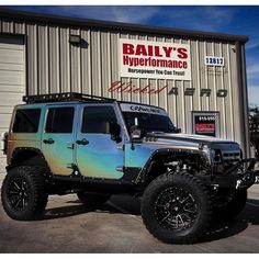 a jeep parked in front of a building