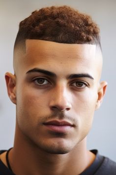 For men with curly hair and an oval face shape, a buzz cut with curls on top is the way to go. The curls add a unique texture while the sides remain buzzed. Click here to check out more best buzz cut hairstyles for men right now. Medium Buzz Cut, Buzz Cut Oval Face Men, Men’s Buzz Cut Taper, Longer Buzz Cut, Men With Curly Hair, Oval Face Shape, Military Buzz Cut