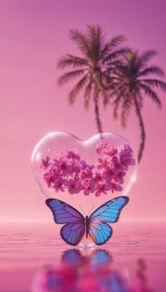 a heart shaped glass with pink flowers and a blue butterfly in the middle, floating on water