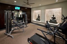 an exercise room with treadmills, machines and other equipment in it's center