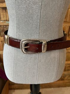 This versatile croc embossed Brighton Western belt is reversible. You can have a brown belt with gold and silver hardware or a black belt with gold and silver hardware or alternating brown and black belt. The spout is in good condition with just minor signs of wear. This belt is a size 34. See photos for details and measurements, please. SZ 34 Full length 39 1/4" Waist 30" - 34" Width 1 1/8" Lauryn Hill, Western Life, Western Belt, Western Belts, Brown Belt, Suspender Belt, Western Style, Belted Dress, Black Belt