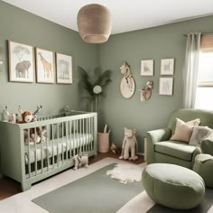 a baby's room with green walls and pictures on the wall