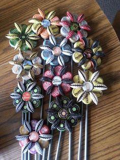 several colorful hair pins on a wooden table