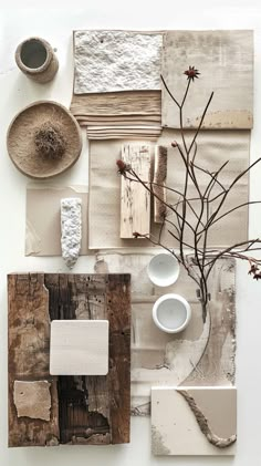 an assortment of different items are arranged on the table top, including cups and saucers