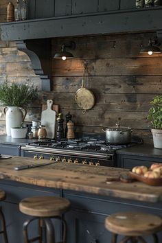 a kitchen with an oven, counter and stools next to the stove in front of it