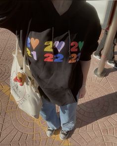 a woman carrying a bag with numbers on it