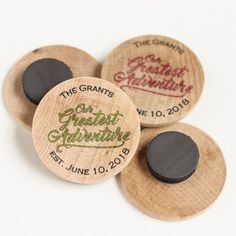 three wooden buttons with the words grand grandfather written on one side and two black ones in the middle