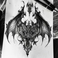 a black and white drawing of a dragon with intricate designs on it's wings