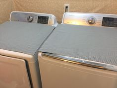 two washers sitting side by side next to each other