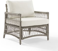 a wicker chair with a white cushion