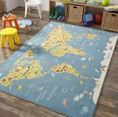 a child's playroom with toys and rugs on the floor in front of it