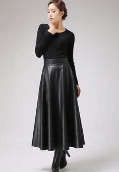 "This faux leather skirt is a timeless piece that goes with everything . This PU vegan skirt looks good away and can dress up or down with swift change of top and shoes. This maxi skirt should be your new wardrobe staple DETAIL * Soft black PU fabric * Vegan fabric * Polyester lining * Back zip closure * Two seam pockets * Midi calf Length * Suit for Autumn, winter and spring SIZE GUIDE Size vary between Brand and Country Please get your body measurement with our Size Guide And Find your size in Fitted Flared Leather Skirt, Fall Party Full Maxi Skirt, Elegant Faux Leather Midi Skirt, Faux Leather Lined Midi Skirt, Elegant Long Leather Skirt, Elegant Faux Leather Pleated Skirt, Elegant Pleated Faux Leather Skirt, Relaxed Flared Leather Skirt, Winter Leather Midi Skirt