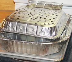 an aluminum foil covered dish sitting on top of a counter