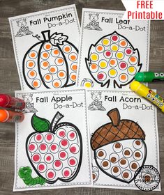 three pumpkins and apples worksheets for fall with colored pencils on the table