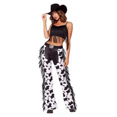 a woman wearing cow print pants and a black top with fringes on the sides