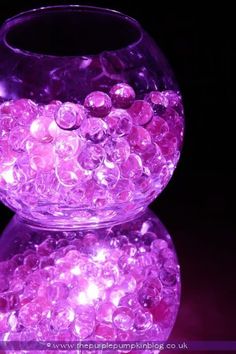 a purple vase filled with lots of bubbles