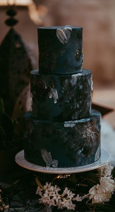 a three tiered cake sitting on top of a table