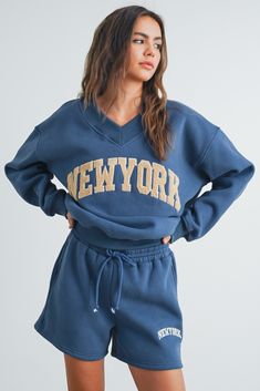 Step up your casual game with our New York Embroidered Sweat Shorts. Made with soft, high-quality fabric for all-day comfort, these shorts also offer a relaxed fit and can be paired with our matching sweatshirt for a complete look. Comfort and style, all in one! Teen Hoodies, V Neck Sweatshirt, Teddy Hoodie, Fall Apparel, Comfy Sweats, Summer 25, Drawstring Waist Shorts, Sweat Set, Matching Sweatshirts