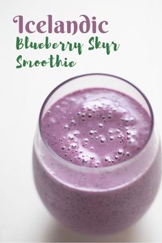 a purple smoothie in a glass with the words icelandic blueberry sky smoothie