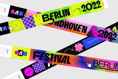 two colorful ribbons with the words berlin in german on them, and an image of flowers