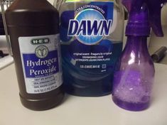 several different types of household cleaning products on a counter top, including detergent and deodorant