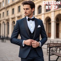 a man in a tuxedo is posing for the camera with his hands on his hips