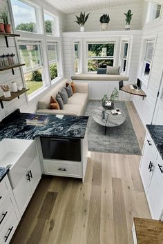 a kitchen and living room in a tiny home