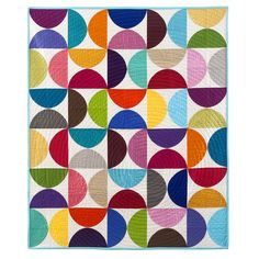 a colorful quilt with circles on it