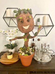 a potted plant sitting on top of a wooden table