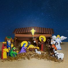 a nativity scene made out of legos on top of hay in the desert