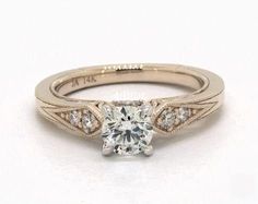 an engagement ring with a diamond in the center and two side stones on each side