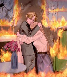 a man and woman hugging in front of a fire