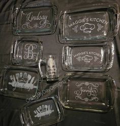 six glass dishes with names and designs on them, one has a beer mug in the middle