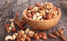 nuts in a wooden bowl on a table