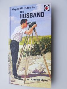 a book with an image of a man on a tripod looking at the sky