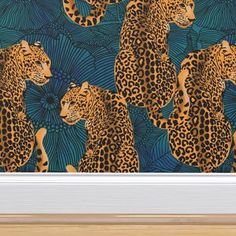 an animal themed wallpaper with leopards and palm leaves on green background in a white frame