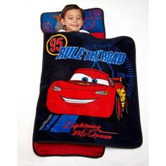 The Disney Cars toddler nap mat features Lightning McQueen and friends out for an adventure as they rule the road. This convenient nap mat is a quilted mat, blanket and pillow all-in-one. This mat rolls up quickly with an easy-to-carry strap, making it perfect for travel, or to take to preschool, grandma's house or for a sleep over. Color: Blue. Preschool Nap Mats, Baby Gym Mat, Toddler Nap Mat, Cars Lightning Mcqueen, Blanket And Pillow, Toddler Nap, Crown Crafts, Nap Mat, Toddler Rooms